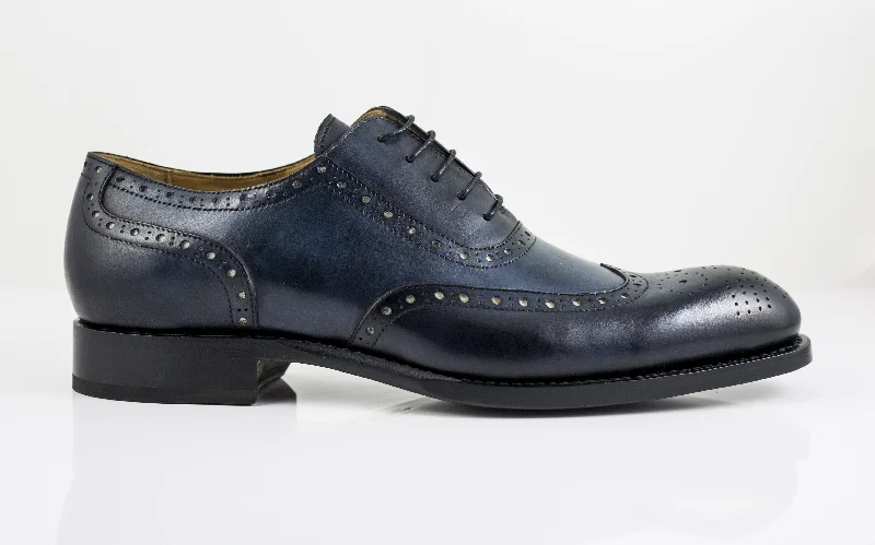 Men's Oxford shoes with a wingtip design and leather soleBurnished Calfskin Wingtip Spectator Oxford Blue